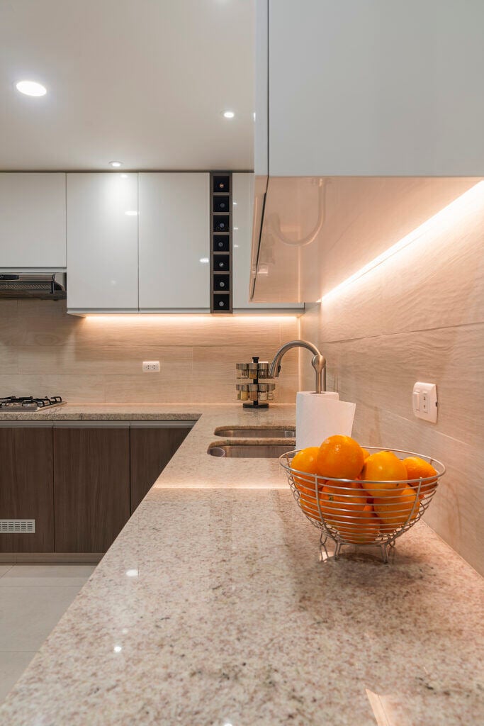 Travertine: The ultimate stone for versatile home renovations - Granite Guy Inc. kitchen sink with mixer tap recessed into granite work surface 1 - Granite Guy Inc.