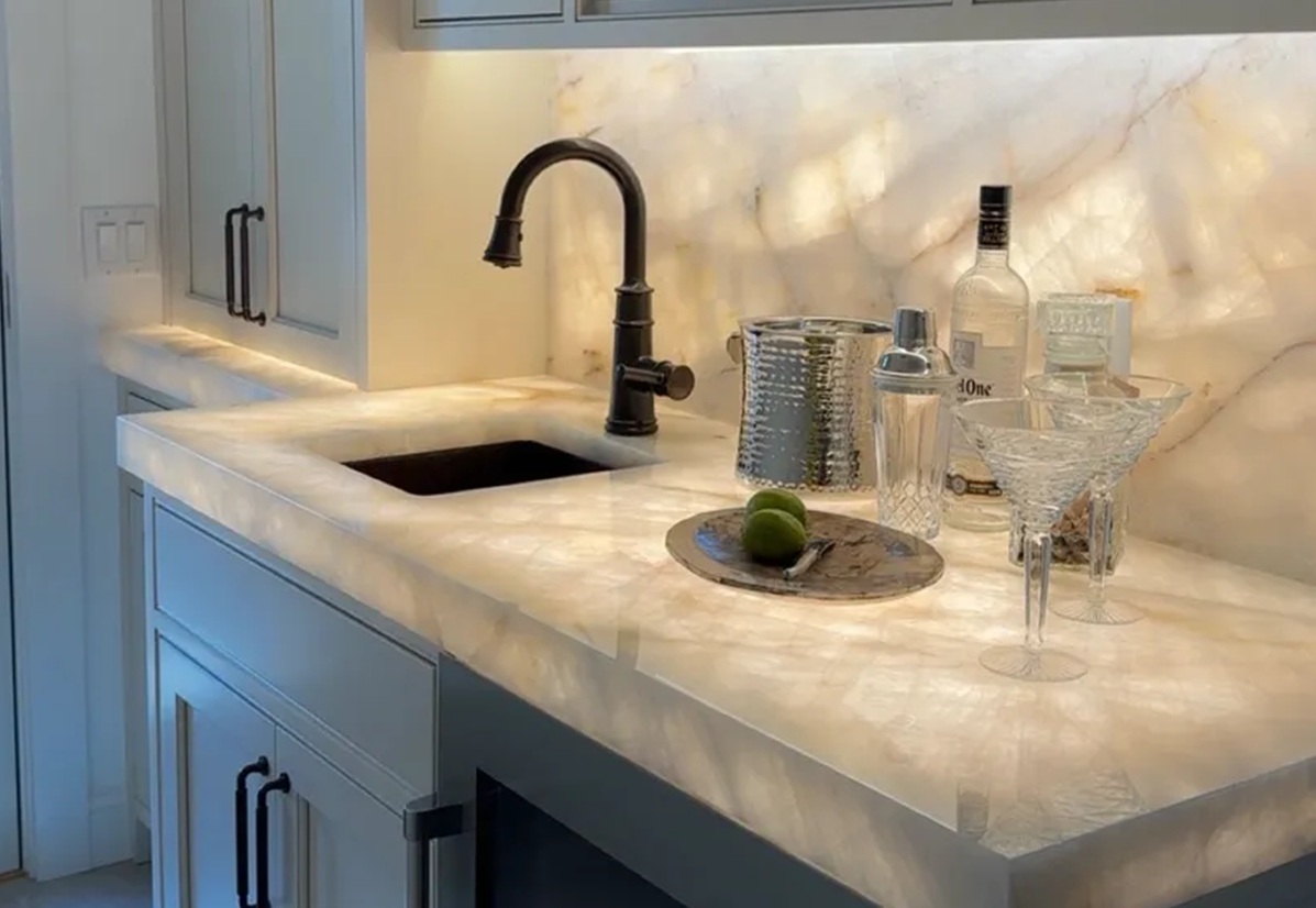 cristallo-quartzite-backlit-wet-bar-cape-cod.jpg Alt text: Finished Cristallo Quartzite wet bar with backlit countertop and full-height backsplash in Cape Cod vacation home