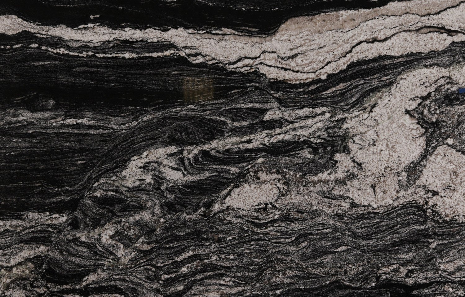 Black Space granite countertops with bold black and white patterns, perfect for kitchen countertops, vanities, and fireplaces by Granite Guy Inc.