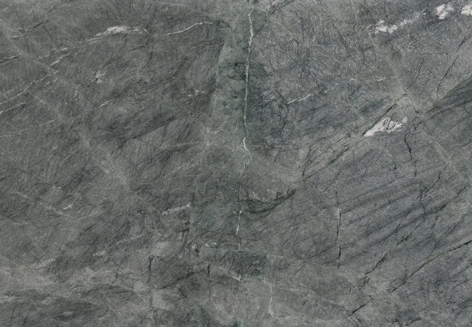 Caribbean Green granite countertops with deep green tones and natural patterns, perfect for kitchen countertops and vanities by Granite Guy Inc.