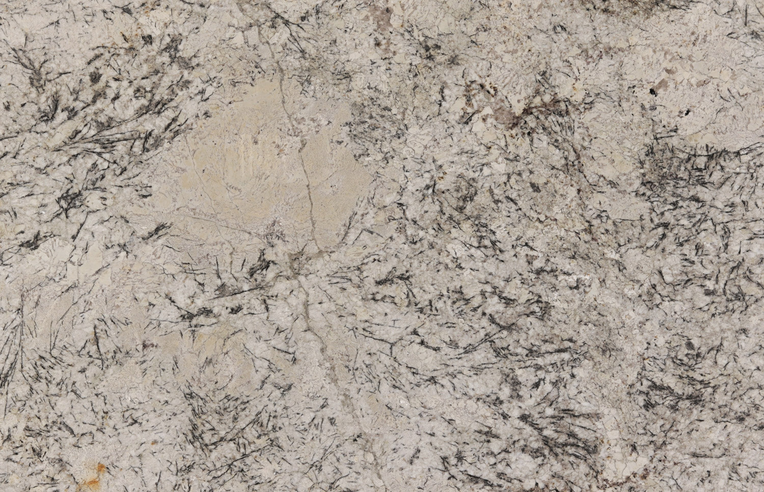 Cold Springs granite countertops with light beige tones and striking dark patterns, perfect for kitchen countertops and vanities by Granite Guy Inc.