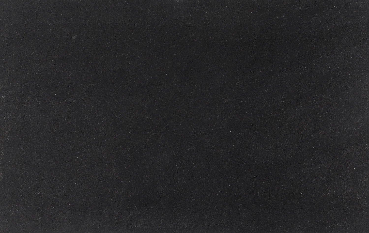 Negresco honed granite countertops with a sleek black finish, perfect for kitchen countertops and fireplaces by Granite Guy Inc.