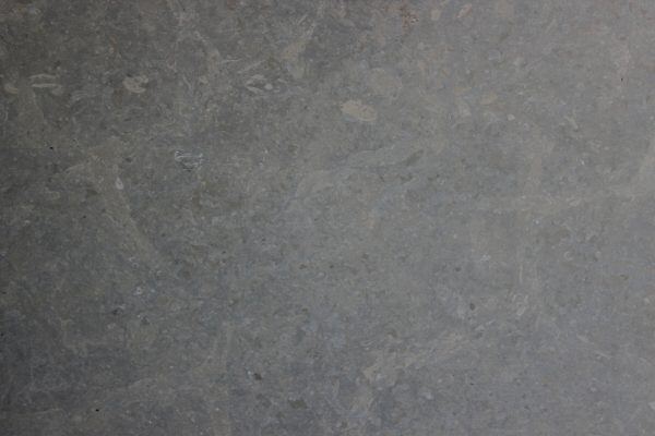 Limestone Blue Chevernie Honed countertops, deep gray-blue tone with organic fossil pattern, great for kitchen countertops. Limestone by Granite Guy Inc.