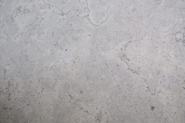 Limestone Gascogne Blue Honed countertops in a cool gray-blue tone with subtle natural movement, great for kitchen countertops. Limestone by Granite Guy Inc.