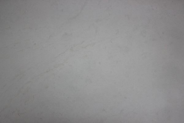 Limestone Lunah Beige Honed countertops with a smooth beige tone and minimal pattern, great for kitchen countertops. Limestone by Granite Guy Inc.