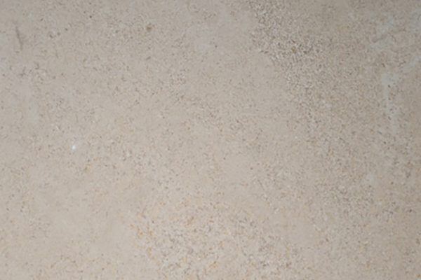 Limestone Santenoy Honed countertops in a warm beige tone with soft speckled texture, great for kitchen countertops. Limestone by Granite Guy Inc.