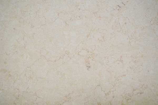 Limestone Sunny countertops in a warm golden beige tone with natural veining, great for kitchen countertops. Limestone by Granite Guy Inc.