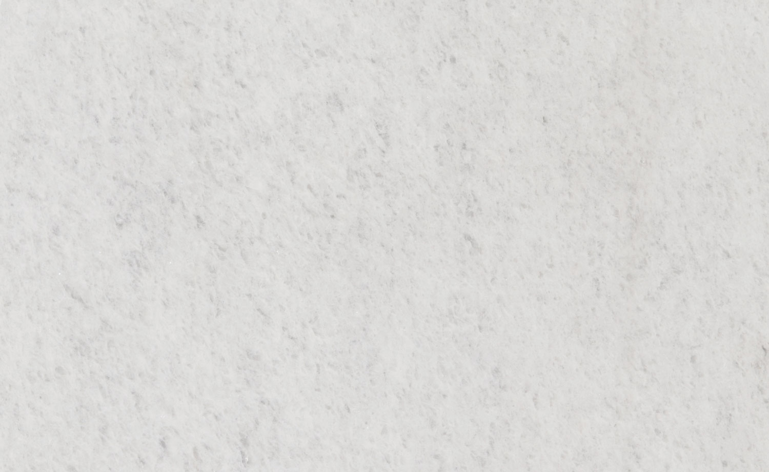 Bianco Neve marble countertops with a subtle white background and soft speckled pattern, perfect for kitchen countertops by Granite Guy Inc.