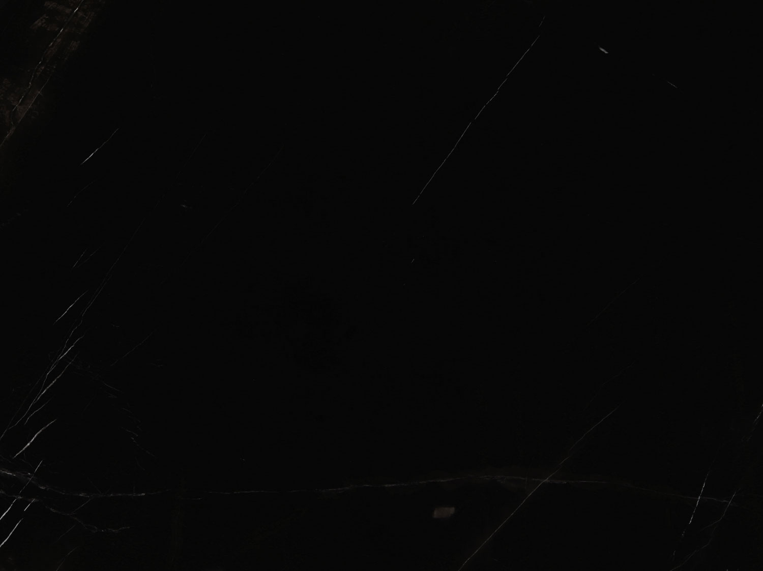 Black Moon marble countertops with deep black tones and subtle white patterns, perfect for kitchen countertops and bar tops by Granite Guy Inc.
