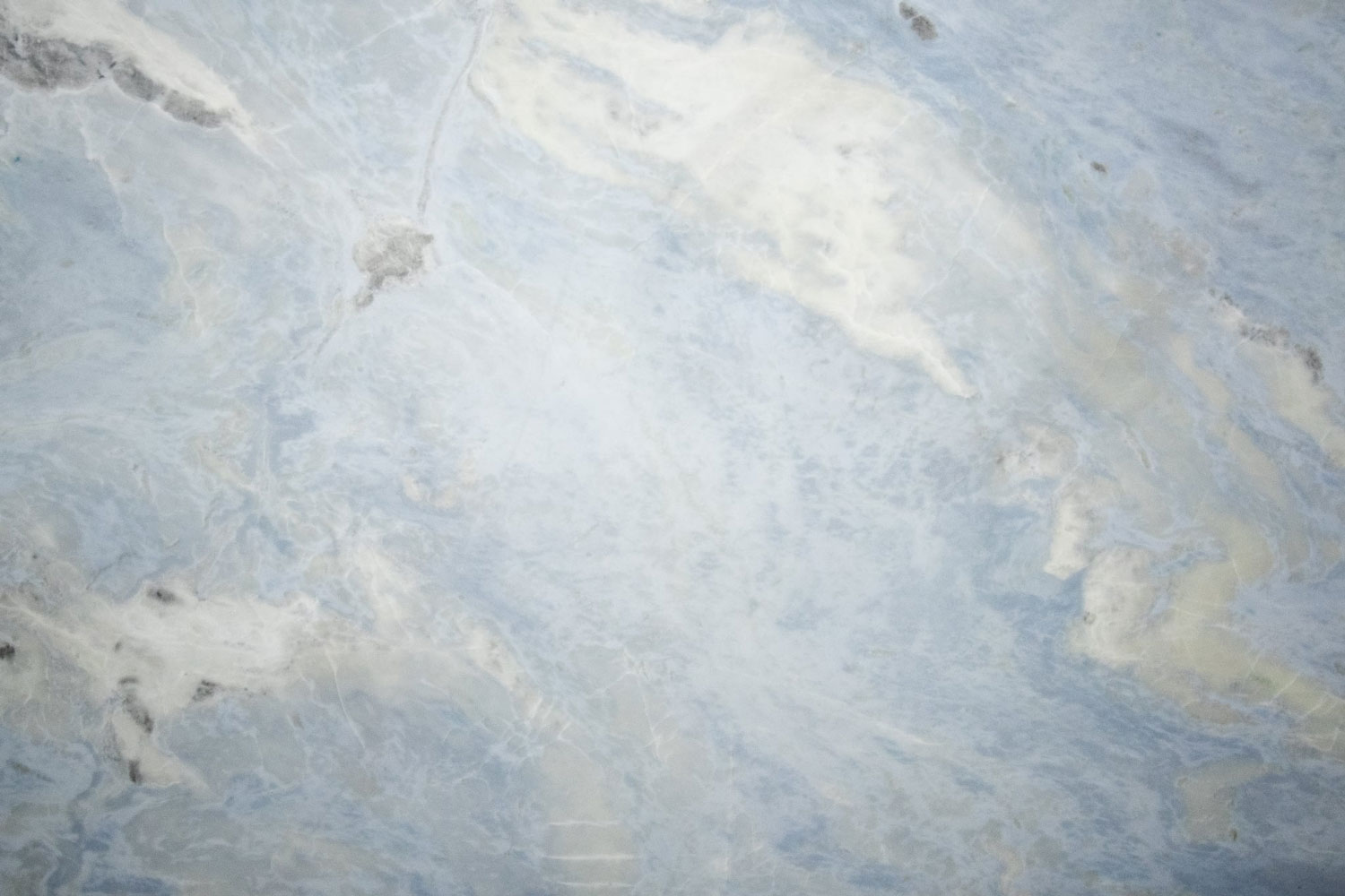 Azzurra marble countertops with soft blue and white patterns, perfect for kitchen countertops and bathroom vanities by Granite Guy Inc.