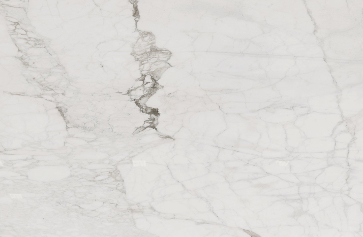 Calacatta Caldia marble countertops with soft white tones and delicate gray veining, perfect for kitchen countertops and islands by Granite Guy Inc.