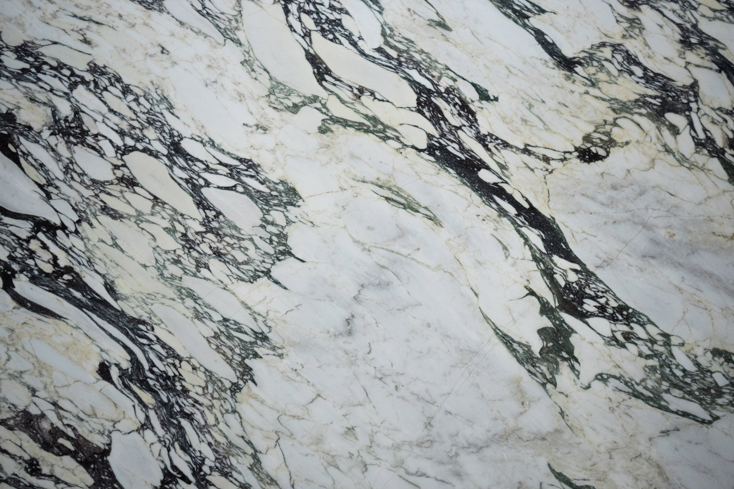 Calacatta Viola marble countertops with bold black and gold veining, perfect for luxurious kitchen countertops and statement islands by Granite Guy Inc.