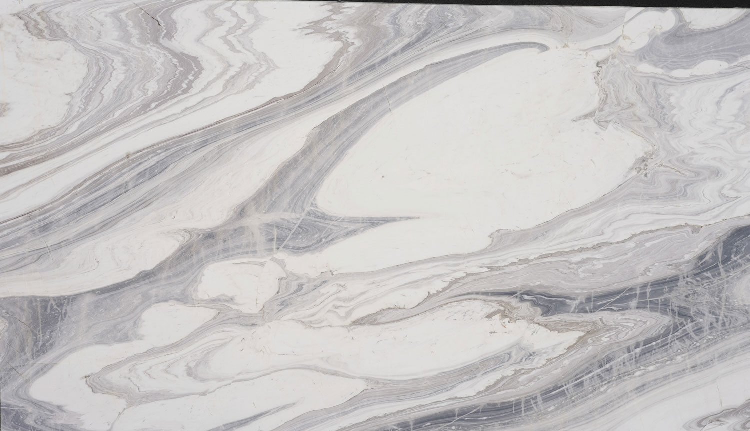 Mont Bianco marble countertops with elegant white and gray flowing patterns, perfect for kitchen countertops and fireplaces by Granite Guy Inc.