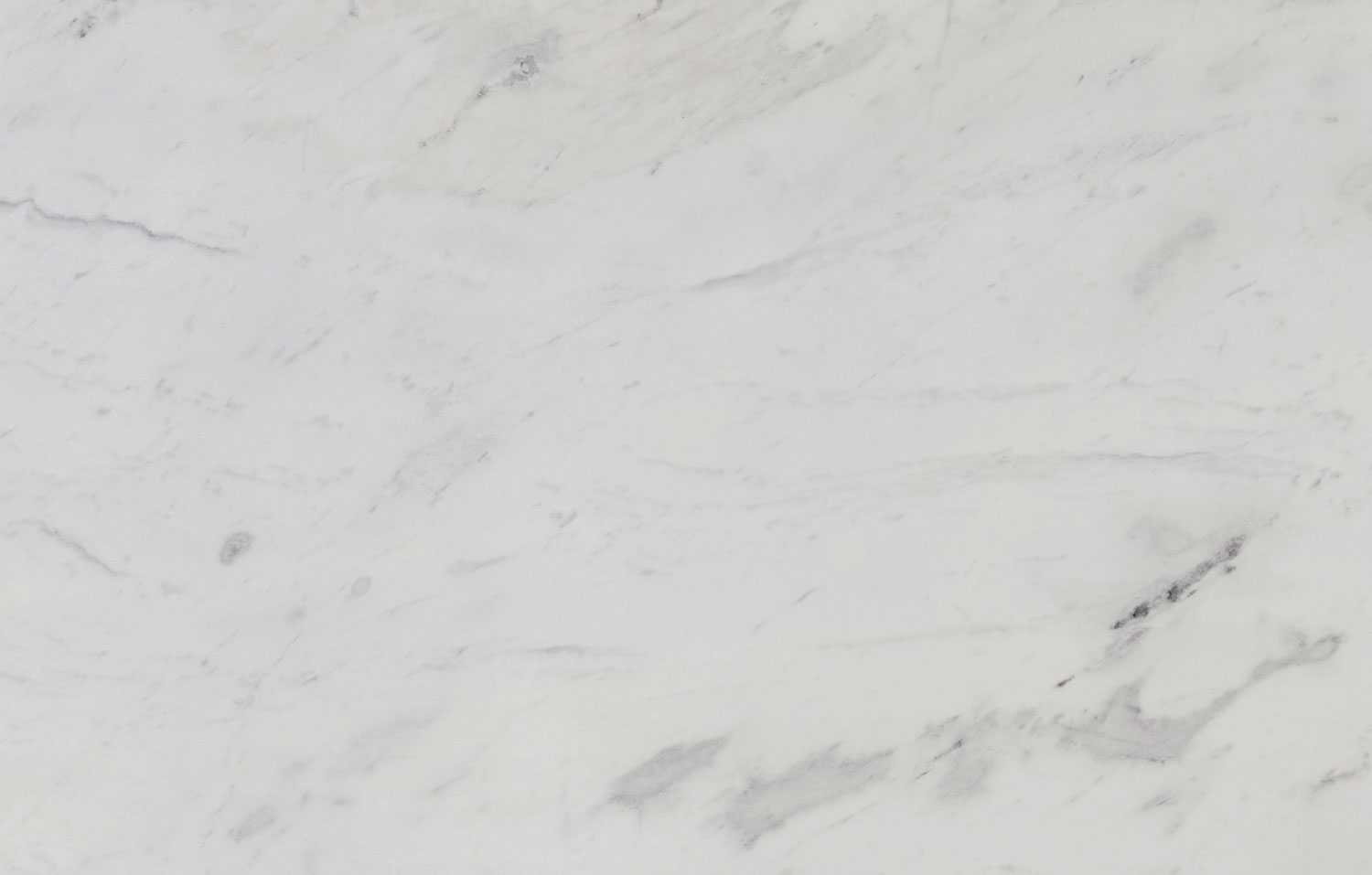 Olympus White marble countertops with a soft white base and subtle gray patterning, perfect for kitchen countertops by Granite Guy Inc.