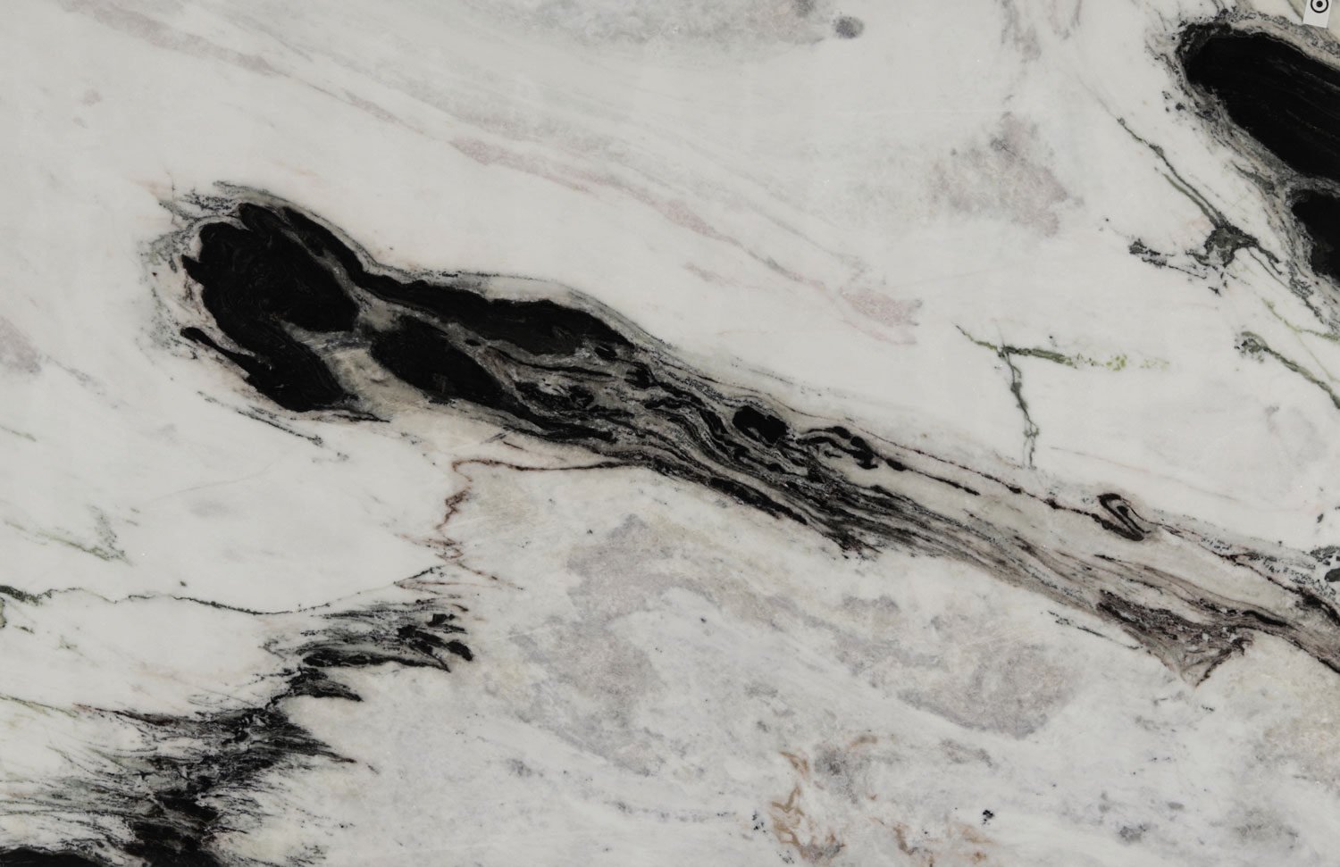 White marble countertops with striking black and white patterns, perfect for kitchen countertops and statement islands by Granite Guy Inc.