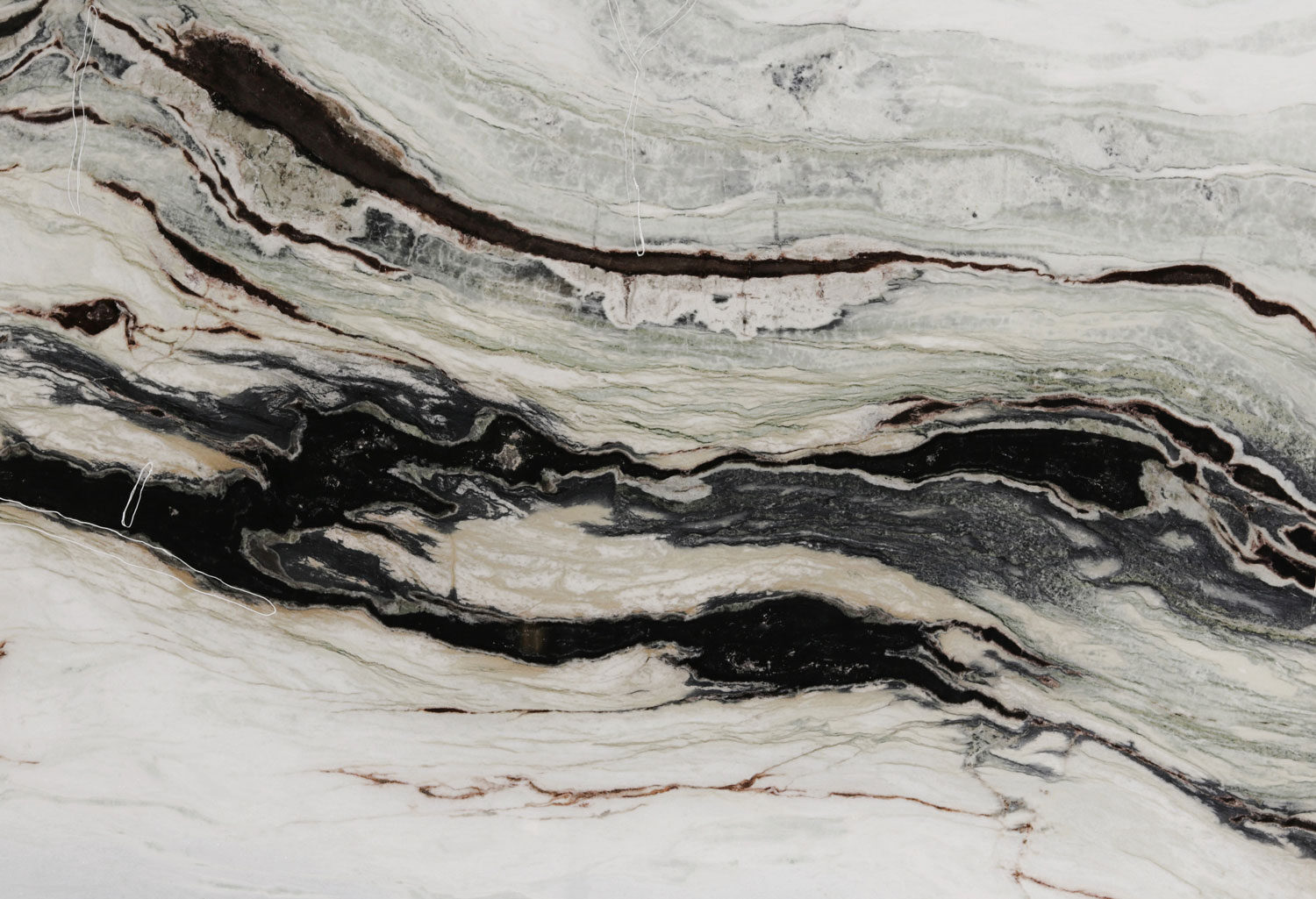 Scandalous marble countertops with bold black, white, and green flowing patterns, perfect for kitchen countertops by Granite Guy Inc.