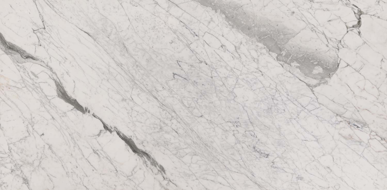 Statuarietto marble countertops with crisp white tones and elegant gray patterns, perfect for kitchen countertops by Granite Guy Inc.