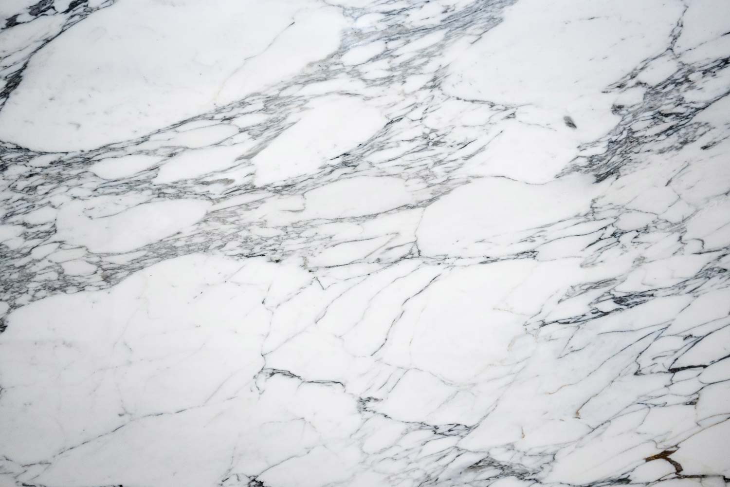 Statuario Vaglio marble countertops with a crisp white base and elegant gray veining, perfect for kitchen countertops by Granite Guy Inc.