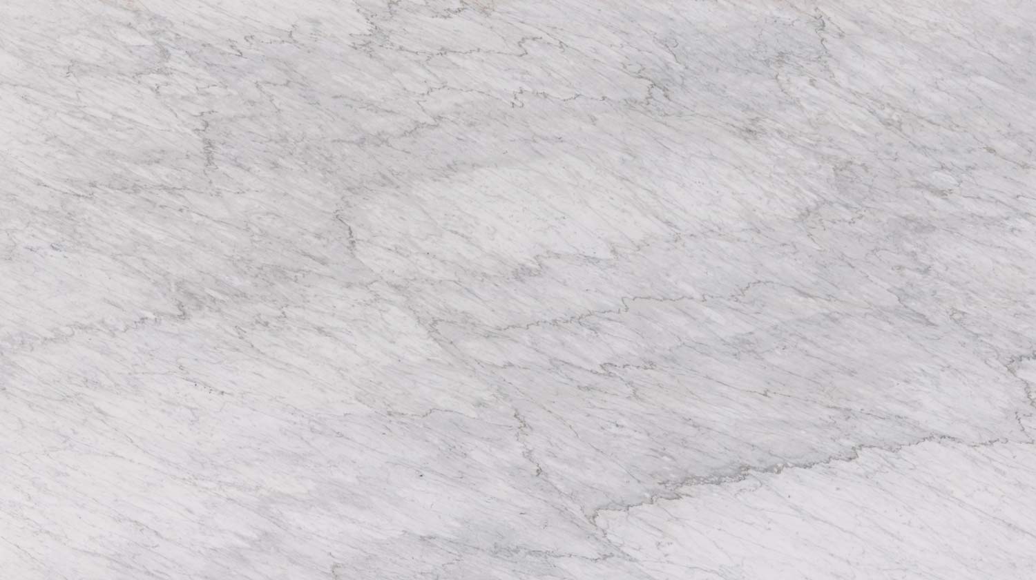White Carrara marble countertops with rich gray patterns, perfect for kitchen countertops and vanities by Granite Guy Inc.