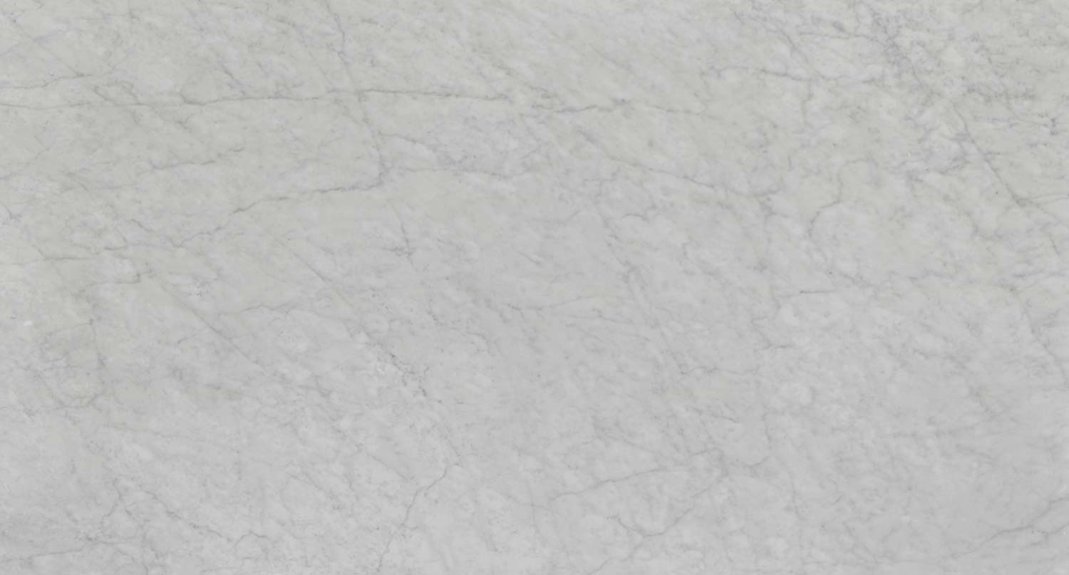 White Carrara Premium marble countertops with soft gray patterns, perfect for kitchen countertops by Granite Guy Inc.