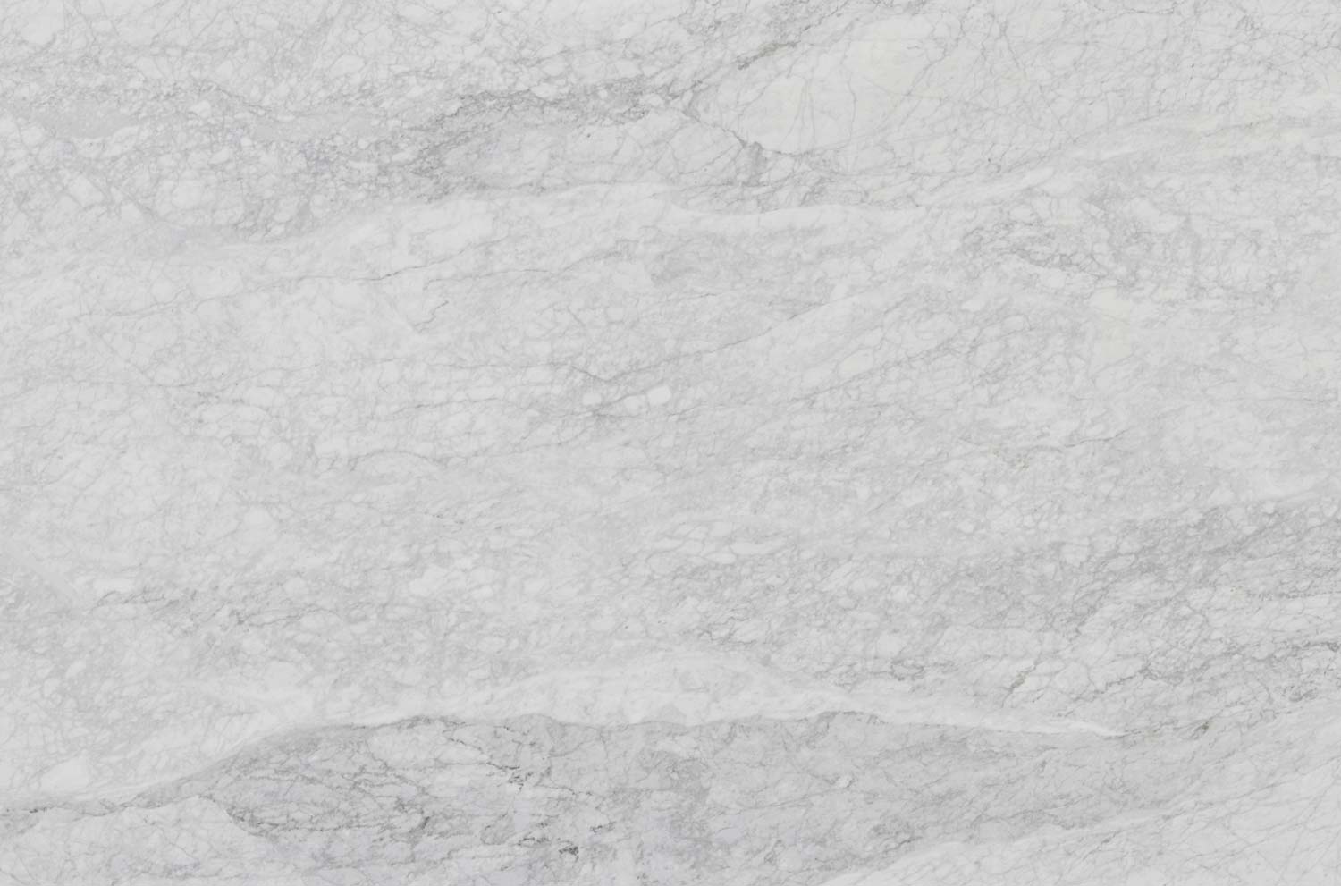 White Carrara Waves marble countertops with flowing gray patterns, perfect for kitchen countertops and vanities by Granite Guy Inc.