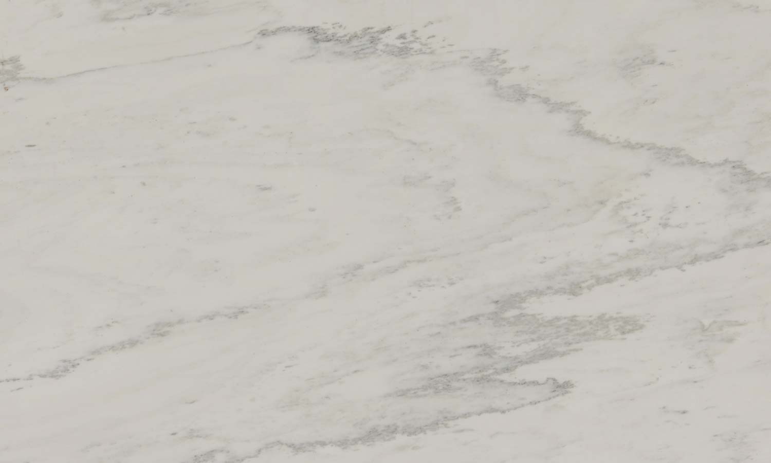 White Danby marble countertops with a creamy white base and soft gray veining, perfect for kitchen countertops by Granite Guy Inc.