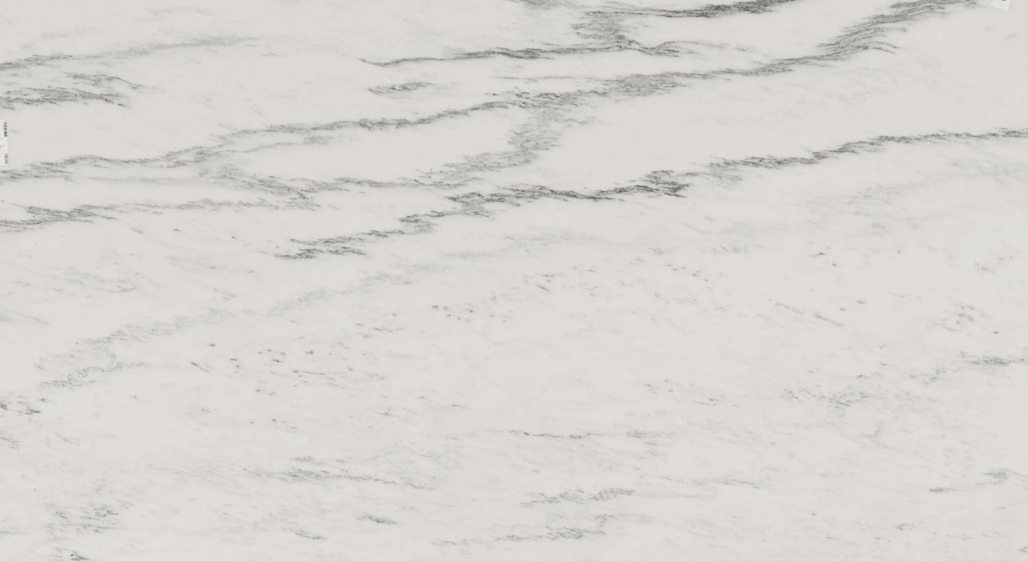 White Mountain marble countertops with soft gray patterns on a crisp white background, perfect for kitchen countertops by Granite Guy Inc.