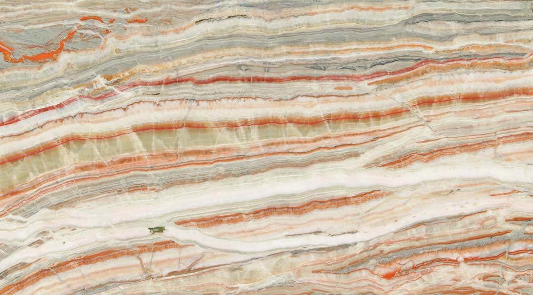 Onyx Bella Rosa Polished countertops with layered orange, red, and cream tones for kitchen countertops. Onyx by Granite Guy Inc.