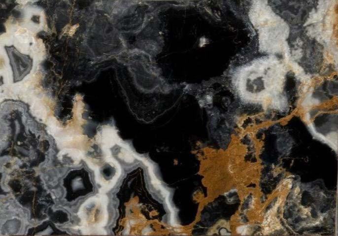 Onyx Black Gold countertops with bold black base, white patches, and striking gold accents for kitchen countertops. Onyx by Granite Guy Inc.