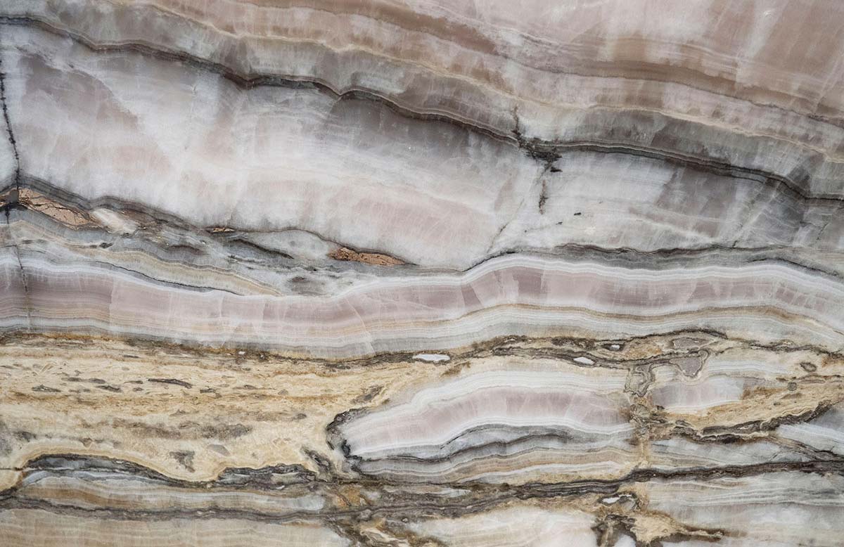 Onyx Byzantine Pink countertops with soft pink and gray patterns, stylish for kitchen countertops. Onyx by Granite Guy Inc.