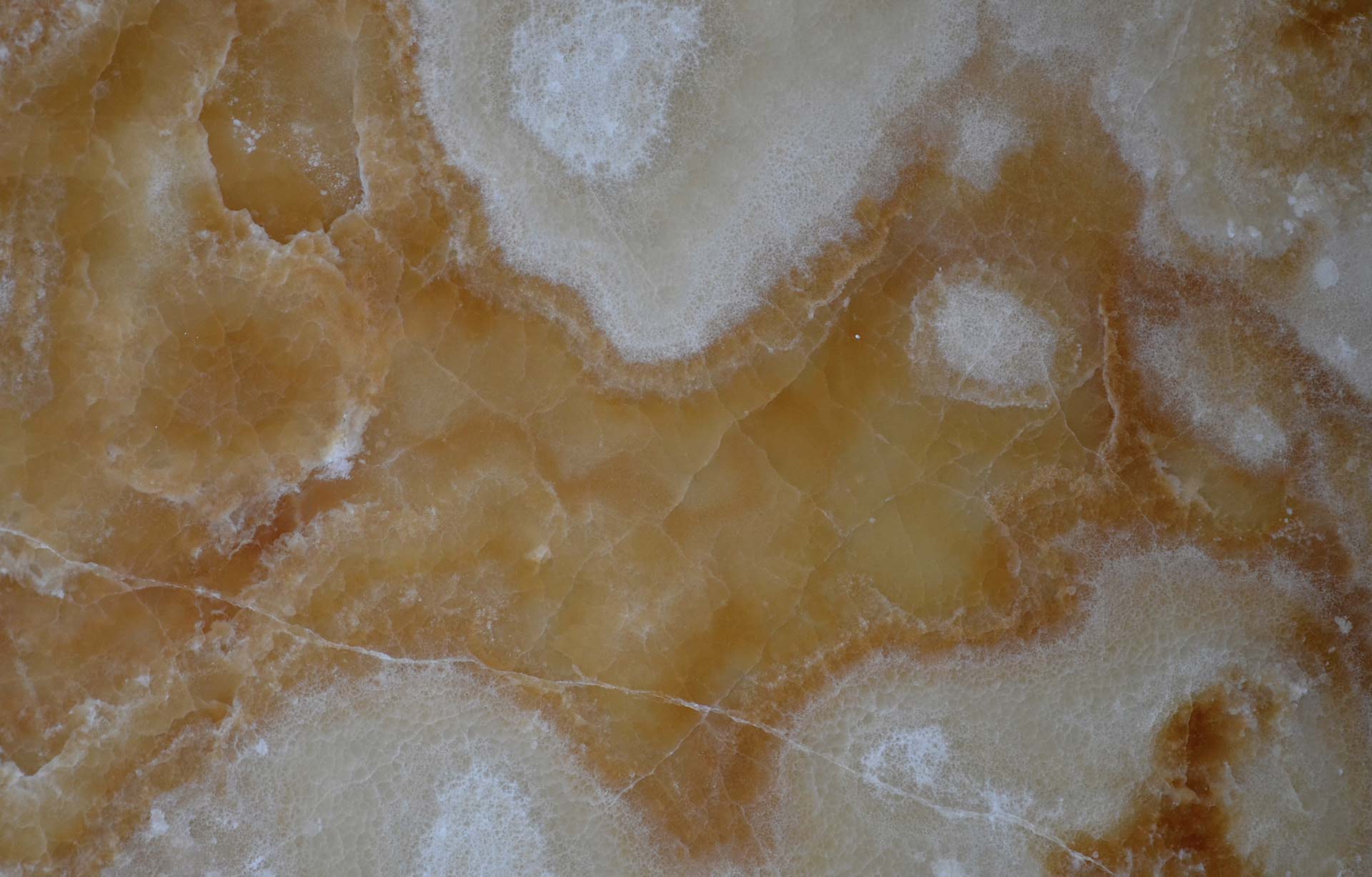 Onyx Cappuccino Polished countertops with warm caramel and cream hues, ideal for kitchen countertops. Onyx by Granite Guy Inc.