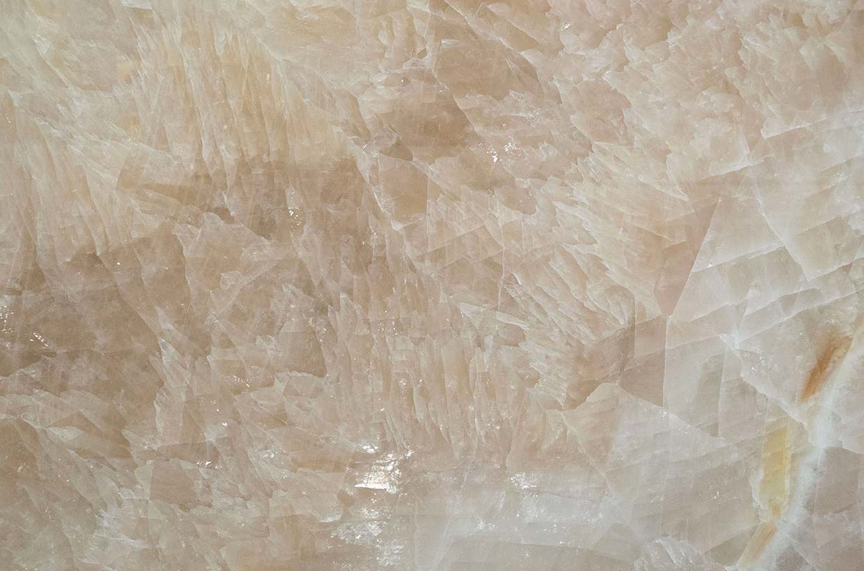 Onyx Gioiello Polished countertops with champagne tones and crystal texture for kitchen countertops. Onyx by Granite Guy Inc.