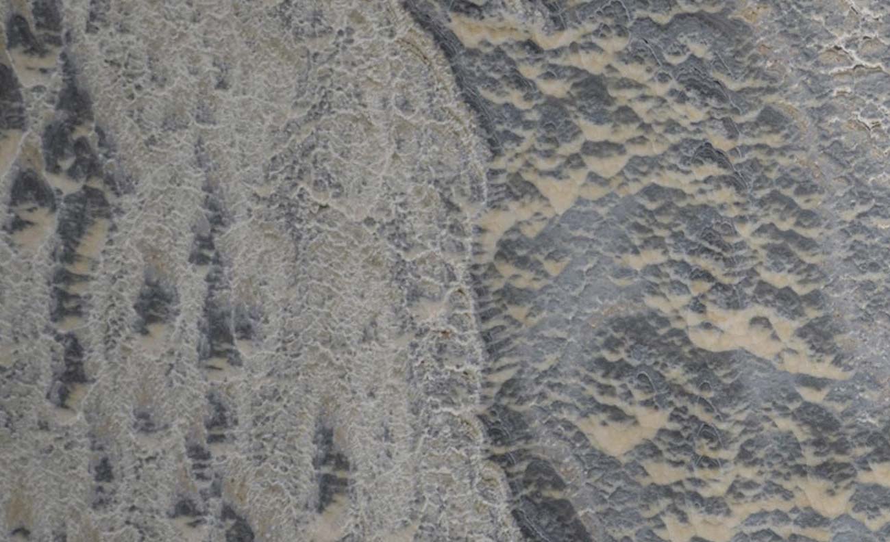 Onyx Grey Textured countertops with bold crystal patterns and deep gray tones for kitchen countertops. Onyx by Granite Guy Inc.
