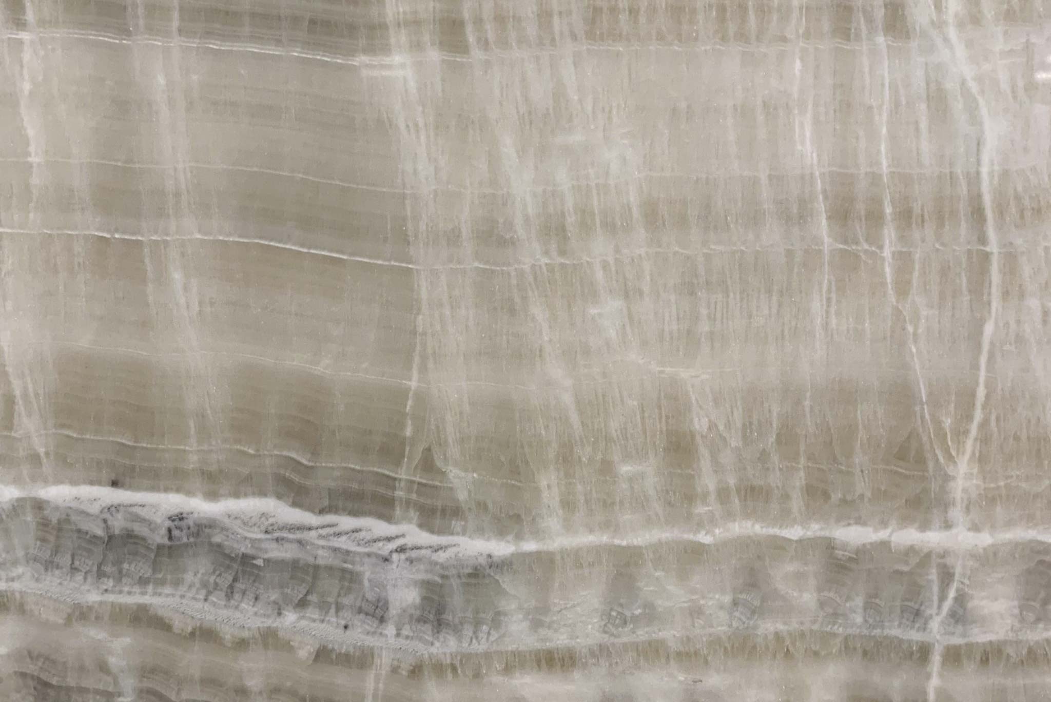 Onyx Lydia countertops with soft beige tones and subtle white veining for kitchen countertops. Onyx by Granite Guy Inc.