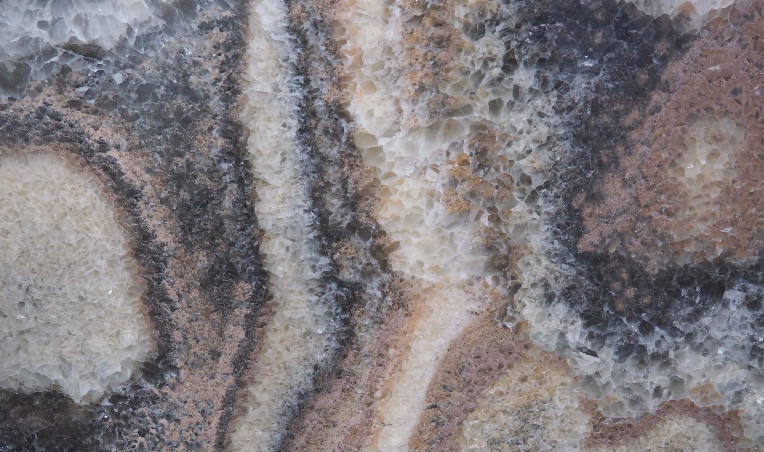 Onyx Mon Amour countertops with crystalline texture, earthy tones, and bold contrast for kitchen countertops. Onyx by Granite Guy Inc.