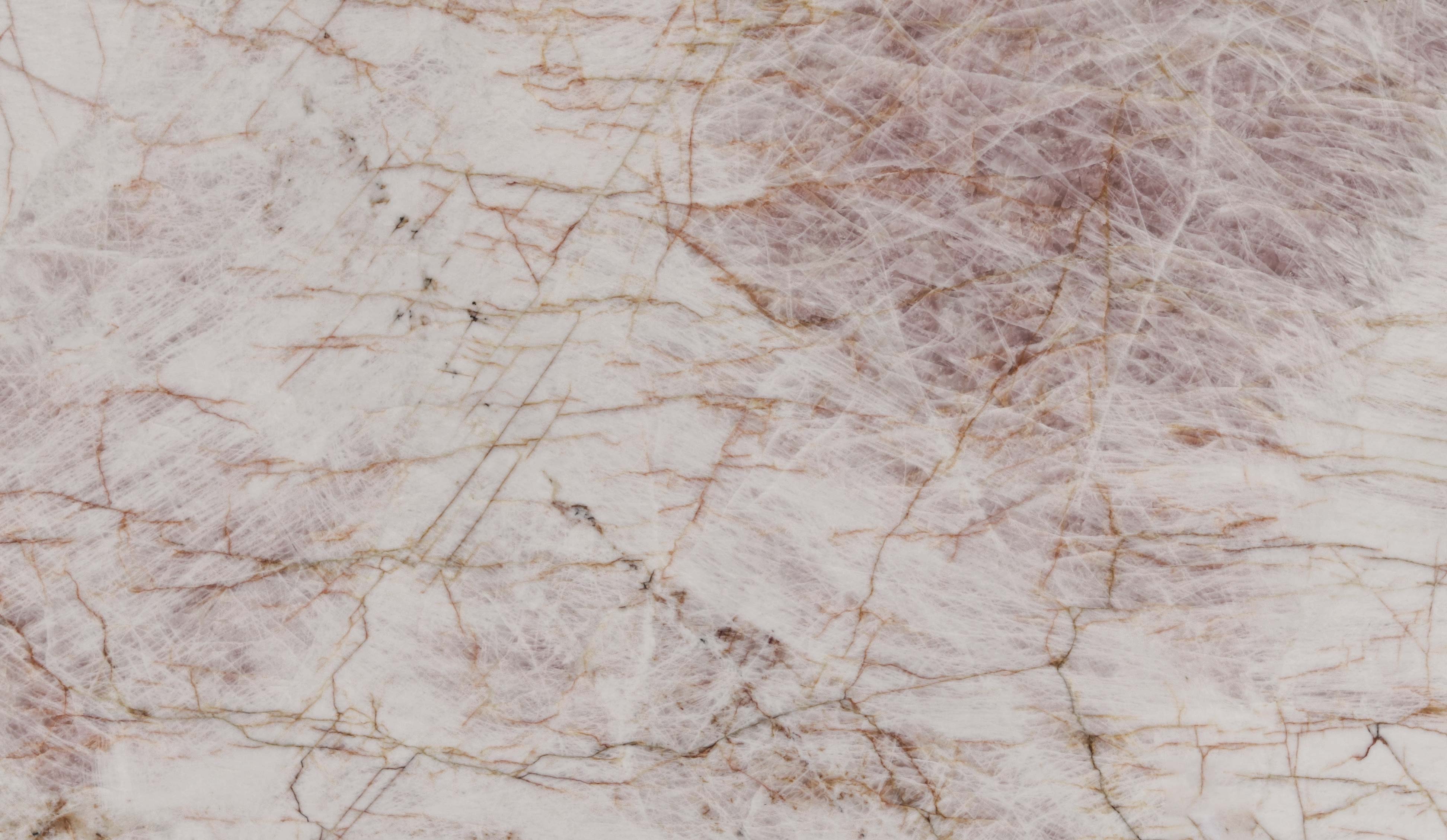 Onyx Pink countertops with soft blush tones and delicate golden veining for kitchen countertops. Onyx by Granite Guy Inc.