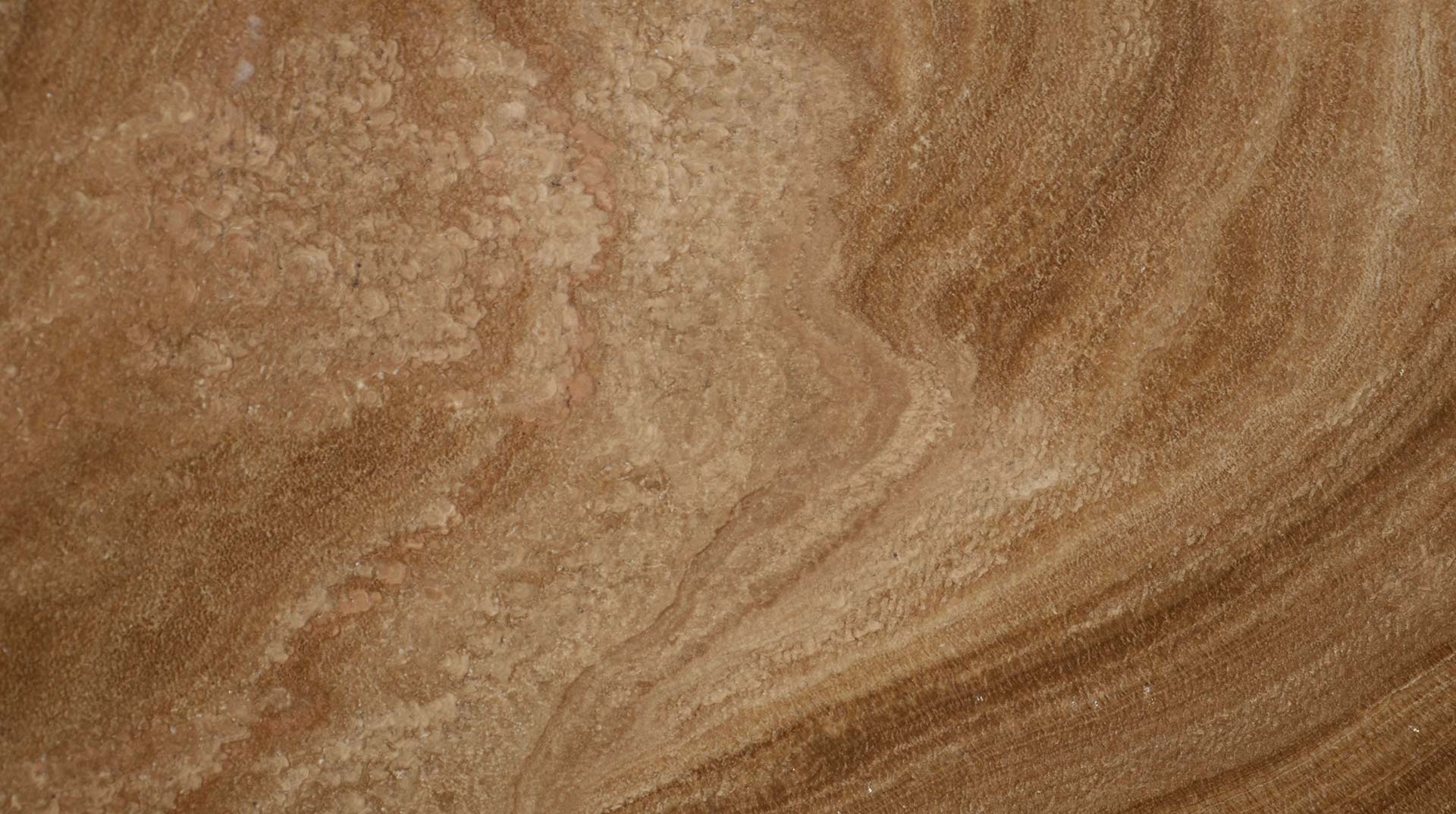 Onyx Stalattite Brown countertops with warm caramel waves and soft texture for kitchen countertops. Onyx by Granite Guy Inc.