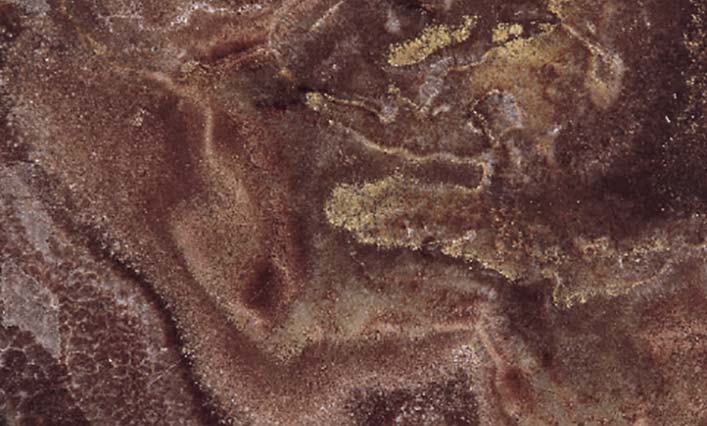 Onyx Tanzania Red countertops with bold red swirls and golden highlights for kitchen countertops. Onyx by Granite Guy Inc.