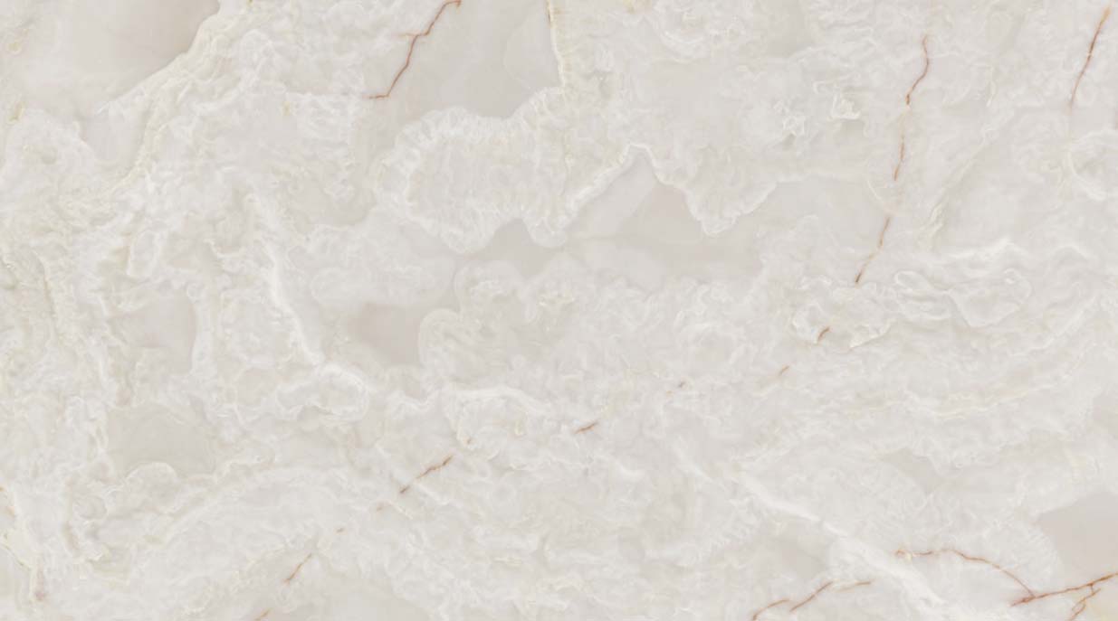 Onyx White Polished countertops with cloudy white tones and soft pink veining for kitchen countertops. Onyx by Granite Guy Inc.