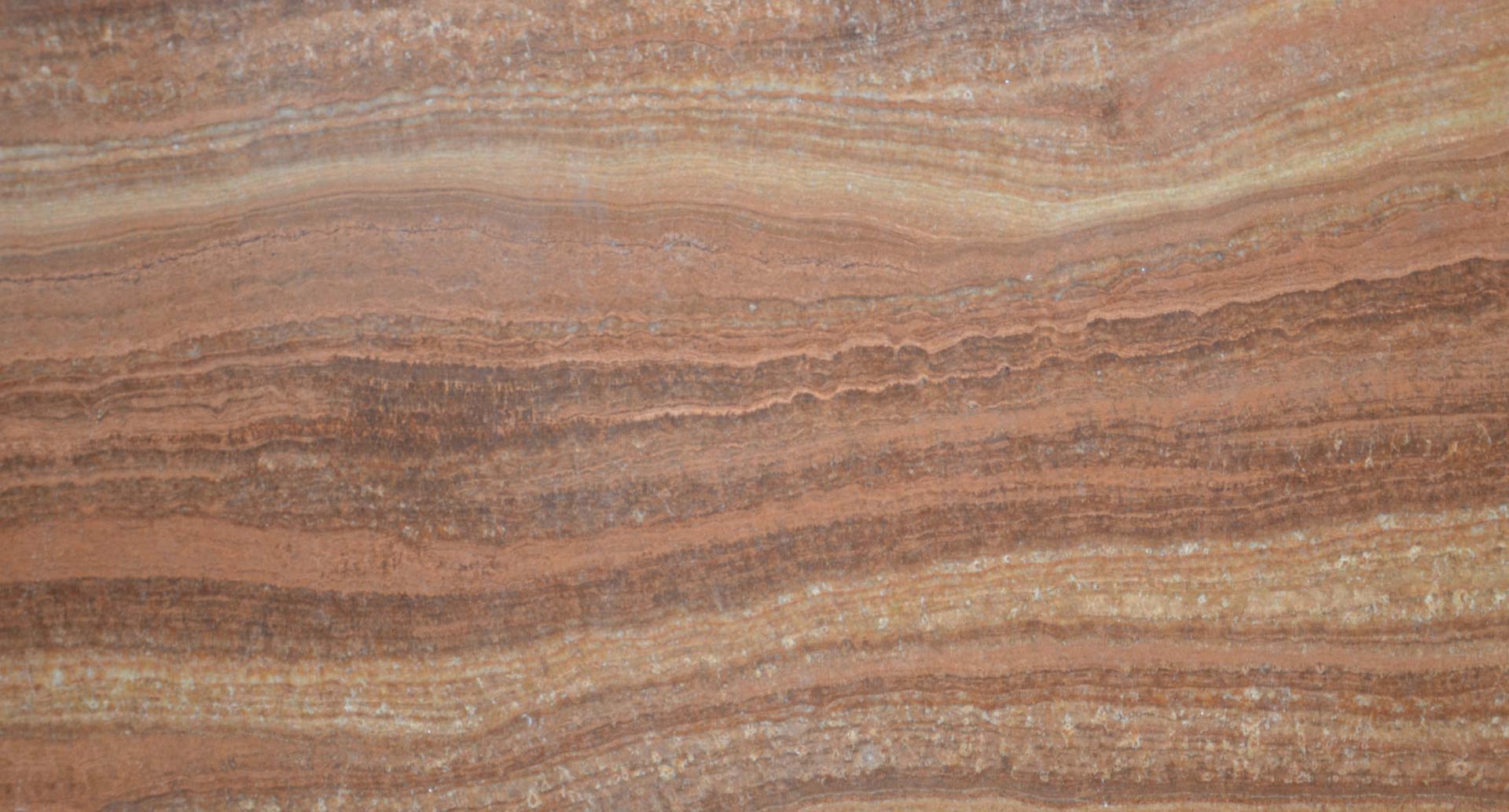 Onyx Wooden Red countertops with rich red and brown banding for kitchen countertops. Onyx by Granite Guy Inc.