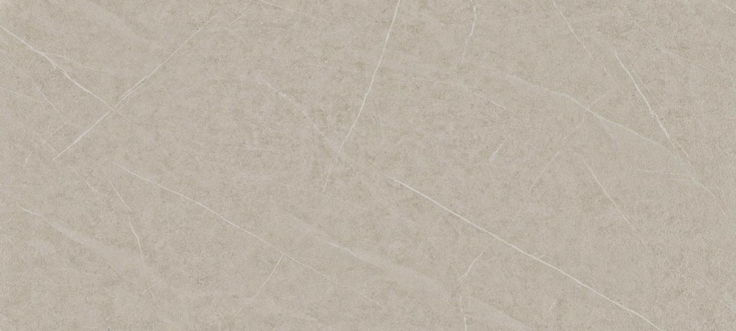 Dekton Adia porcelain for kitchen countertops, also great for shower walls, in a warm beige tone with light veining. Porcelain by Granite Guy Inc.
