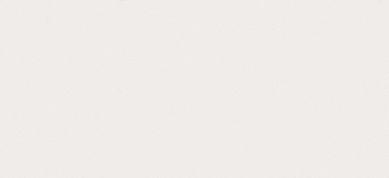 Dekton Aeris porcelain kitchen countertops and shower walls in a soft cream tone with a minimalist matte finish. Porcelain by Granite Guy Inc.