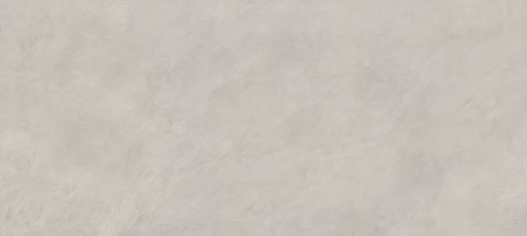 Dekton Argentium porcelain kitchen countertops and shower walls with a smooth beige texture and soft cloudy movement. Porcelain by Granite Guy Inc.