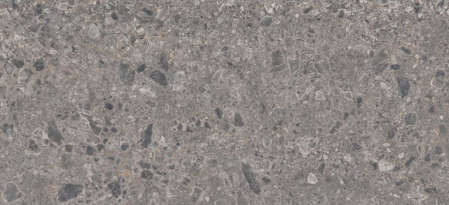 Dekton Gk07 Ceppo porcelain for kitchen countertops, also great for shower walls, in a bold gray terrazzo look. Porcelain by Granite Guy Inc.