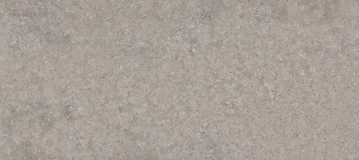 Dekton Grigio porcelain for kitchen countertops, also great for shower walls, in a neutral gray stone texture. Porcelain by Granite Guy Inc.