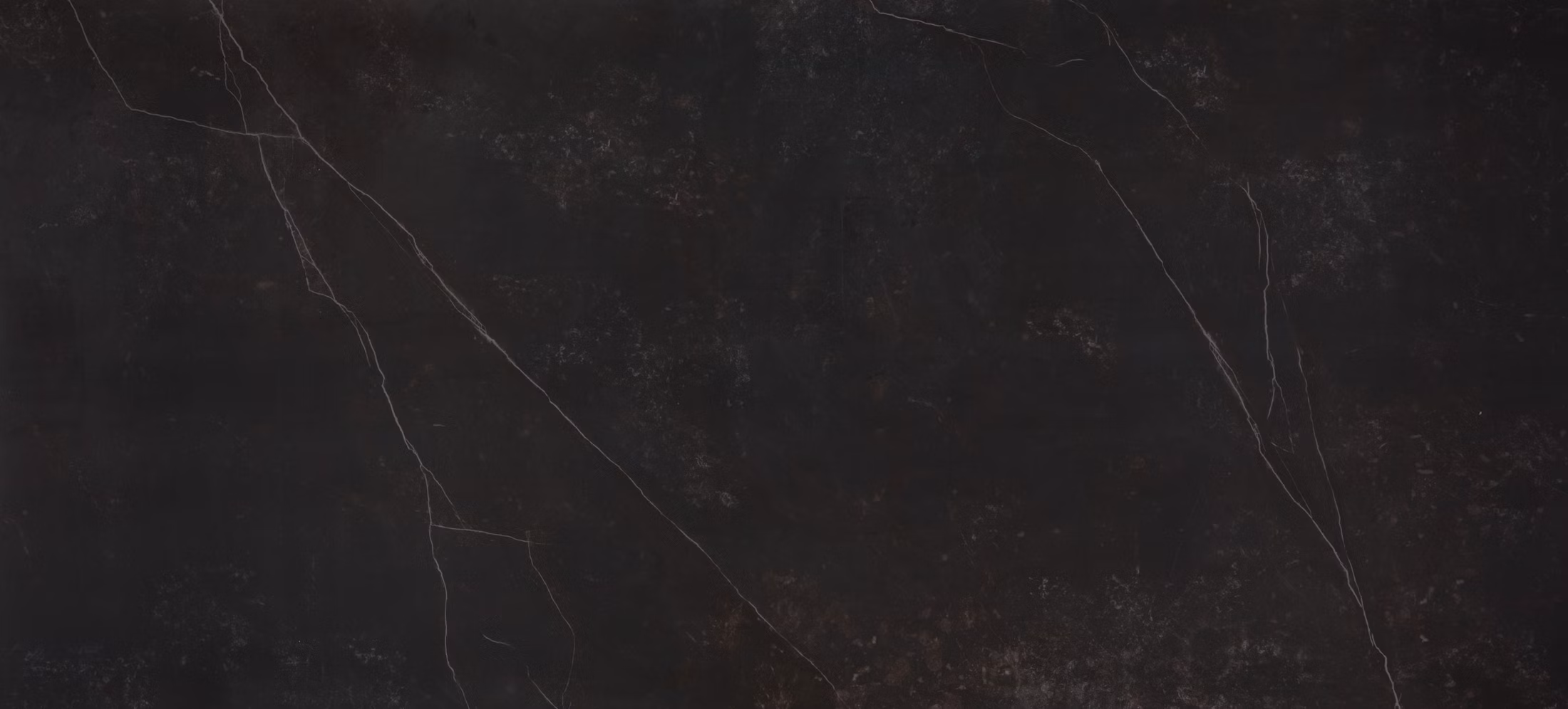 Dekton Kelya porcelain kitchen countertops in a deep black tone with subtle veining. Porcelain by Granite Guy Inc.
