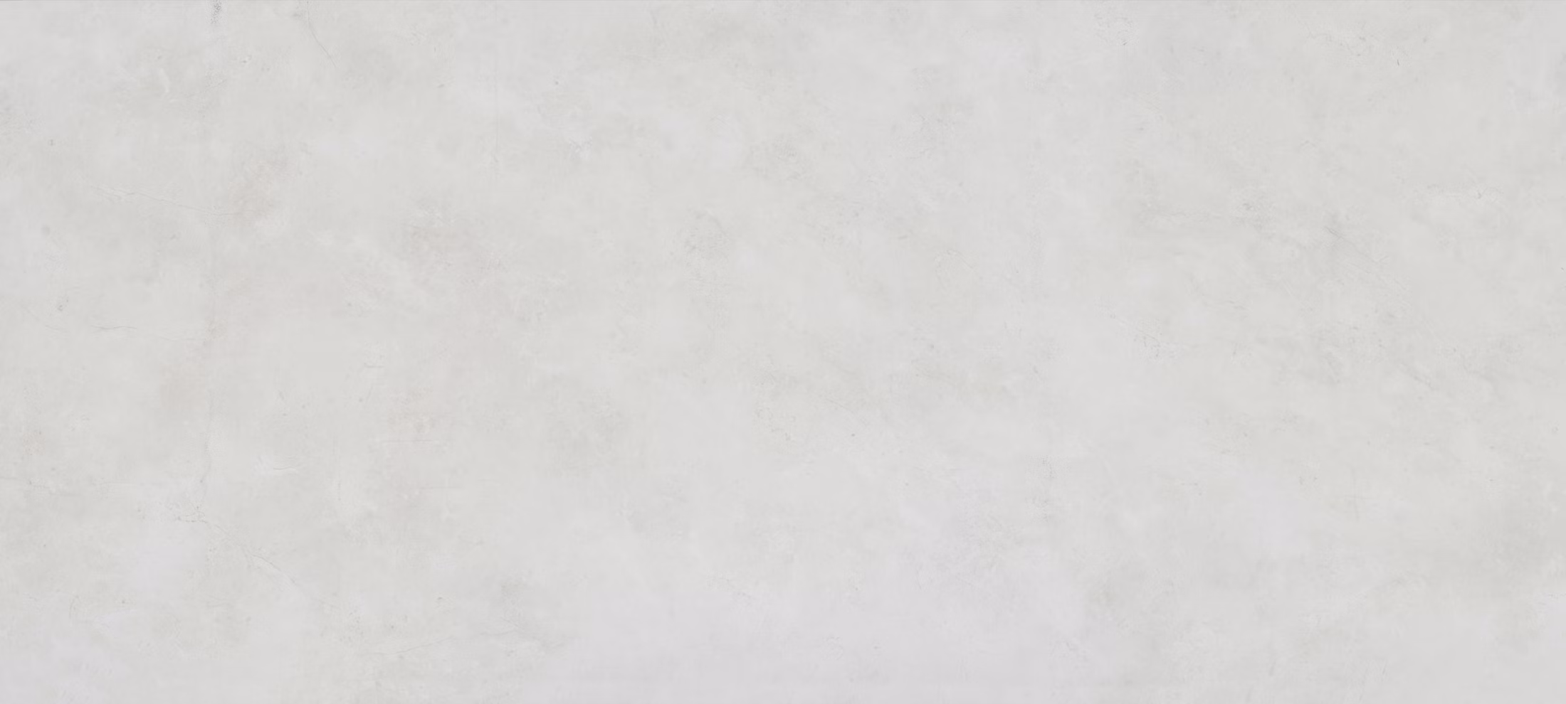 Dekton Sandik porcelain for kitchen countertops, also great for shower walls, in a soft off-white tone. Porcelain by Granite Guy Inc.