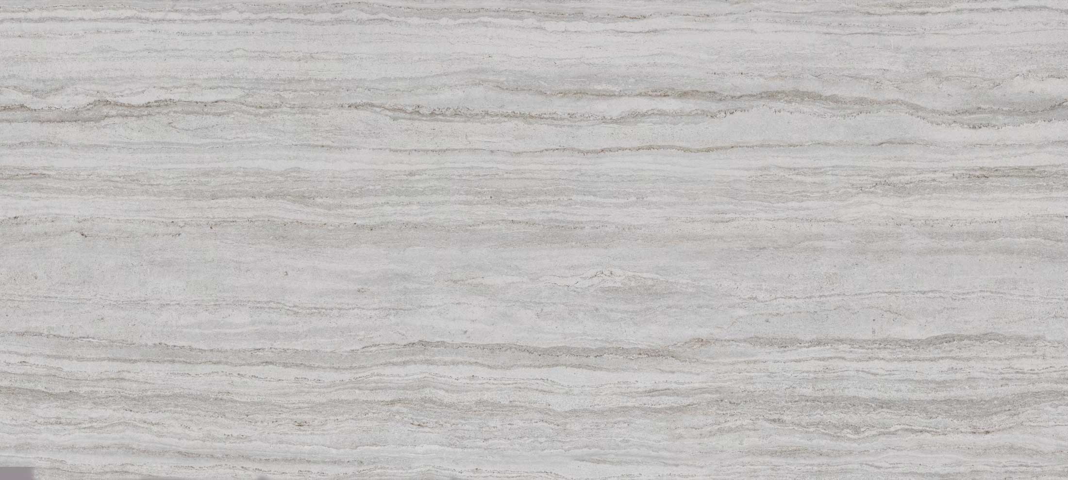 Dekton Trevi porcelain for kitchen countertops, also great for shower walls, in a layered gray travertine look. Porcelain by Granite Guy Inc.