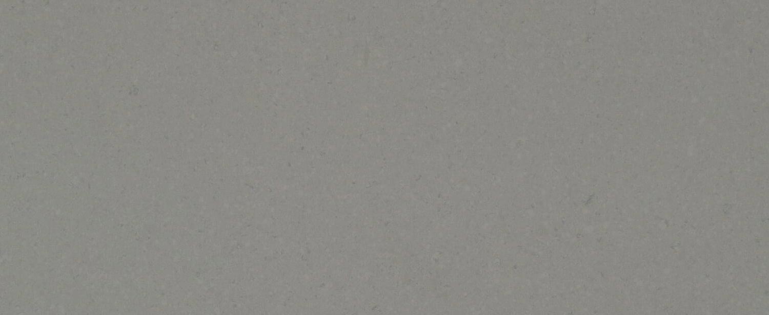 Caesarstone Quartz 4030 Oyster Pebble Stone Grey countertops in a soft, cool gray tone, perfect for kitchen countertops. Caesarstone quartz by Granite Guy Inc.