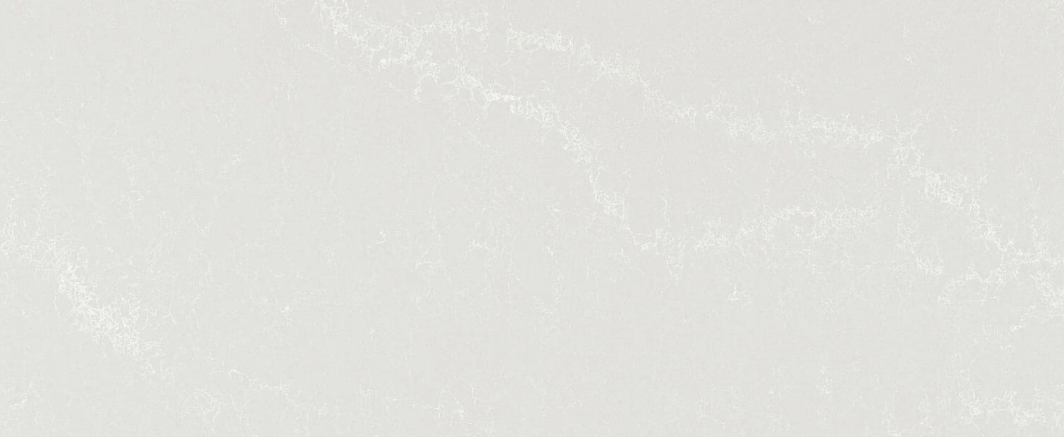 Caesarstone Quartz 5110 Alpine Mist countertops in soft gray with delicate white pattern, ideal for kitchen countertops. Caesarstone quartz by Granite Guy Inc.